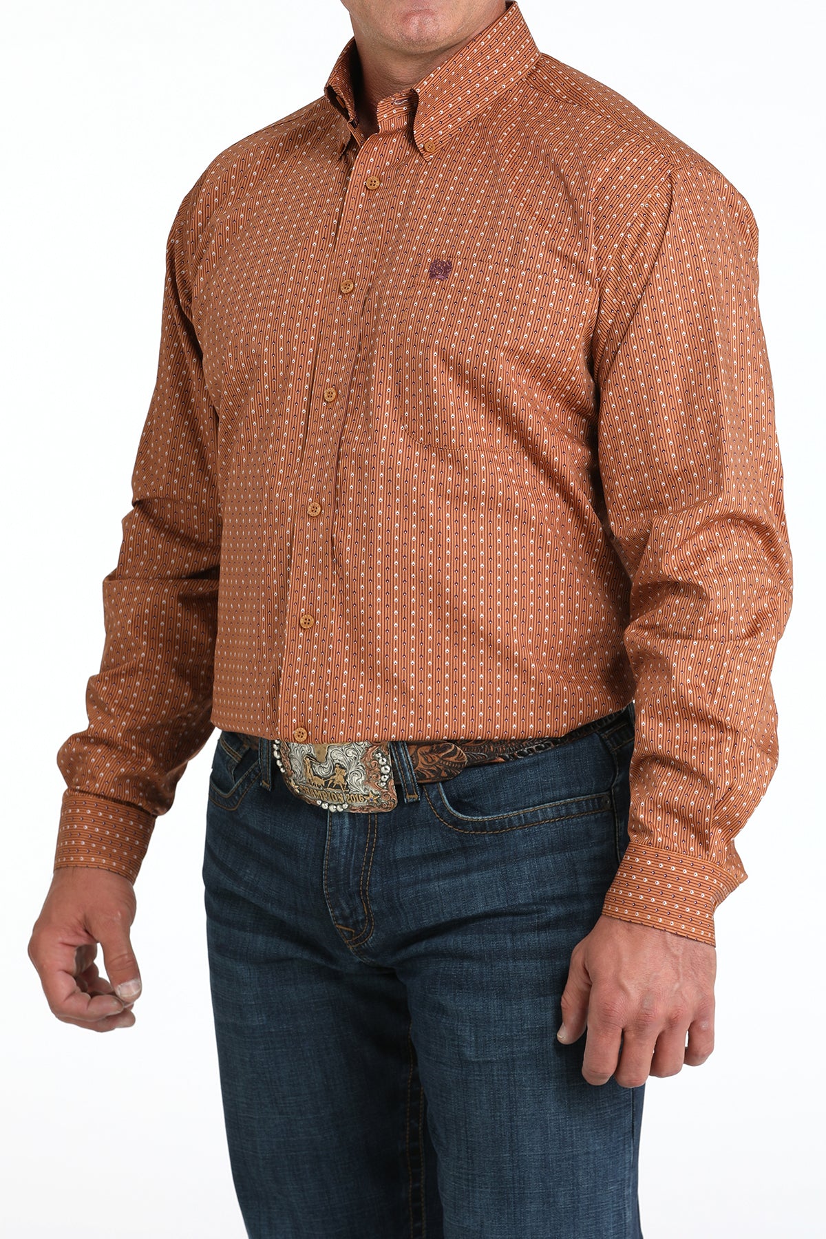 Man wearing a brown long sleeve button-down with jeans and a belt