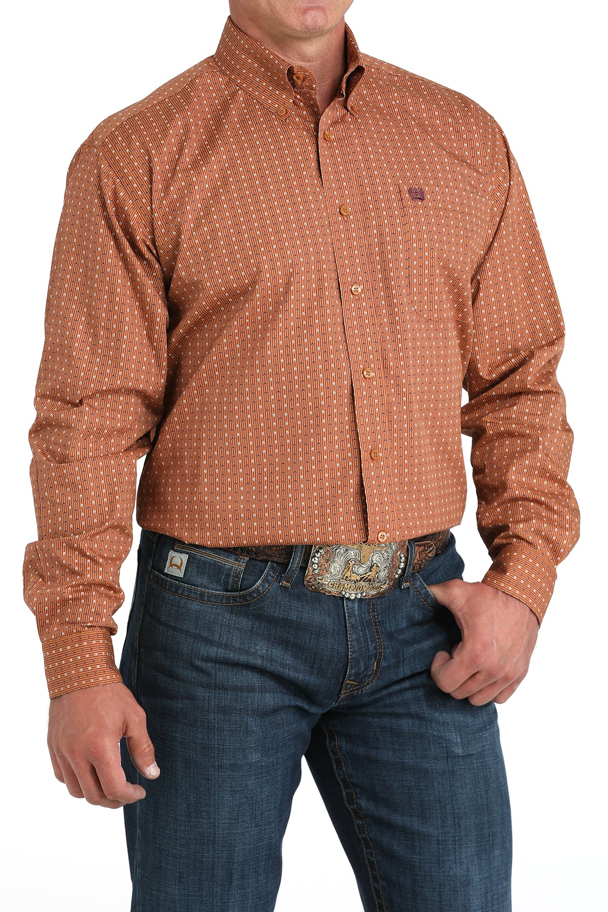 Man wearing a brown long sleeve button-down with jeans and a belt