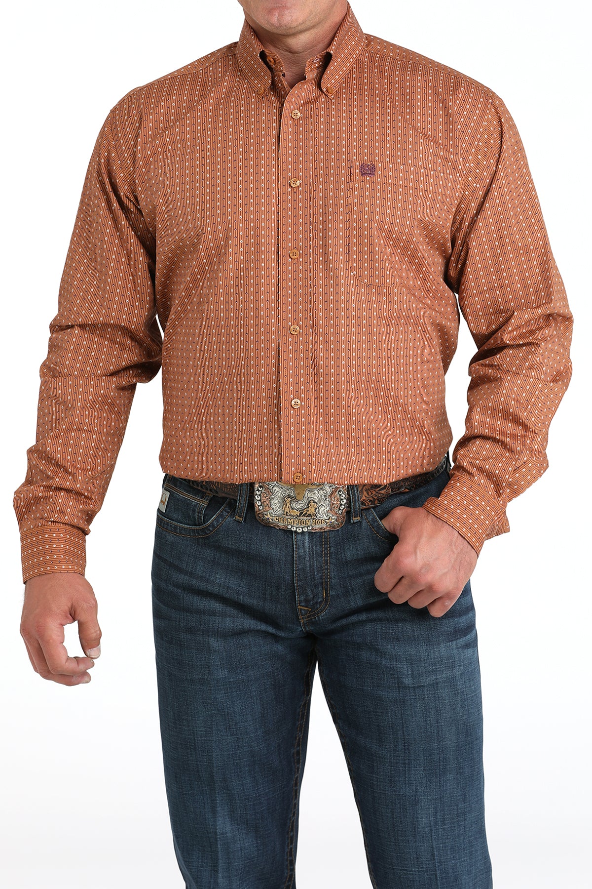 Man wearing a brown long sleeve button-down with jeans and a belt