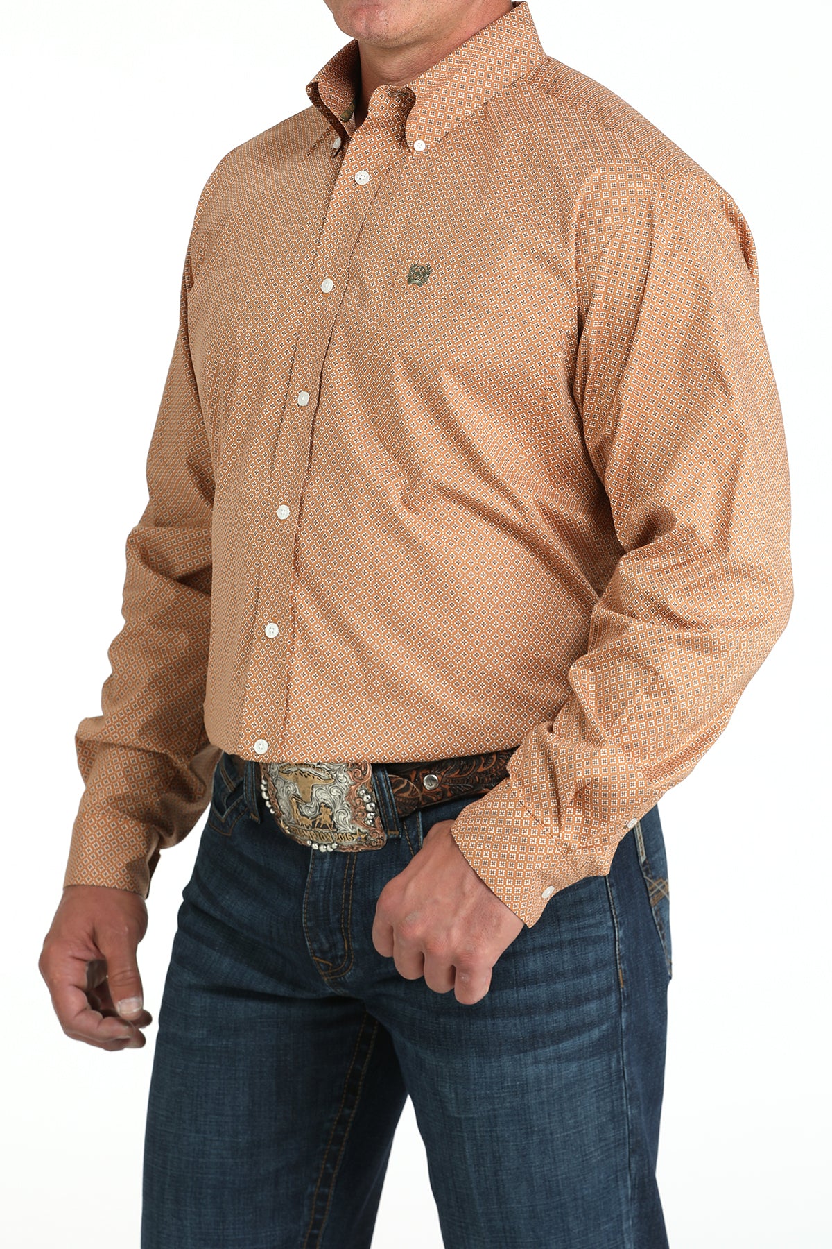 Man wearing a brown long sleeve button-down with jeans and a belt