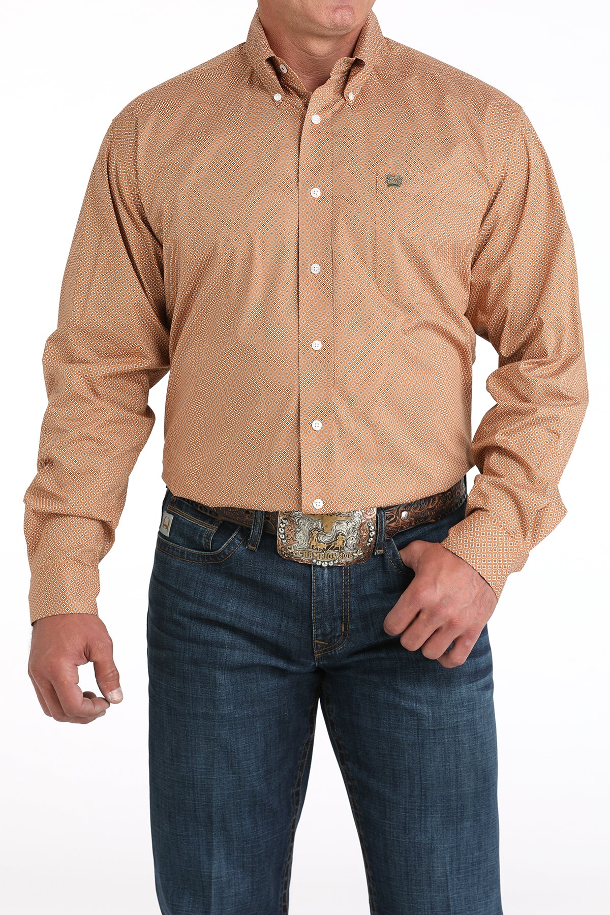 Man wearing a brown long sleeve button-down with jeans and a belt
