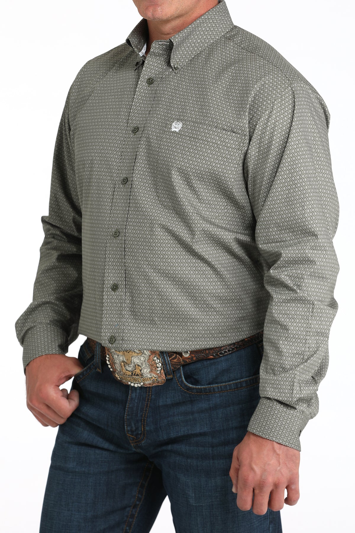 Man wearing a green long sleeve button-down with jeans and a belt