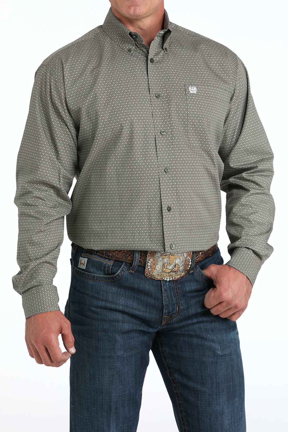 Man wearing a green long sleeve button-down with jeans and a belt