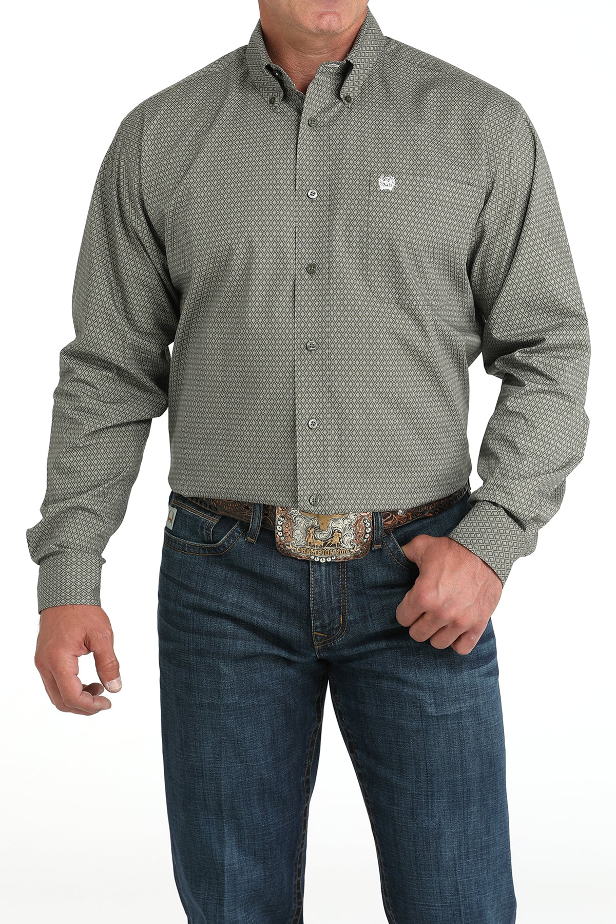 Man wearing a green long sleeve button-down with jeans and a belt