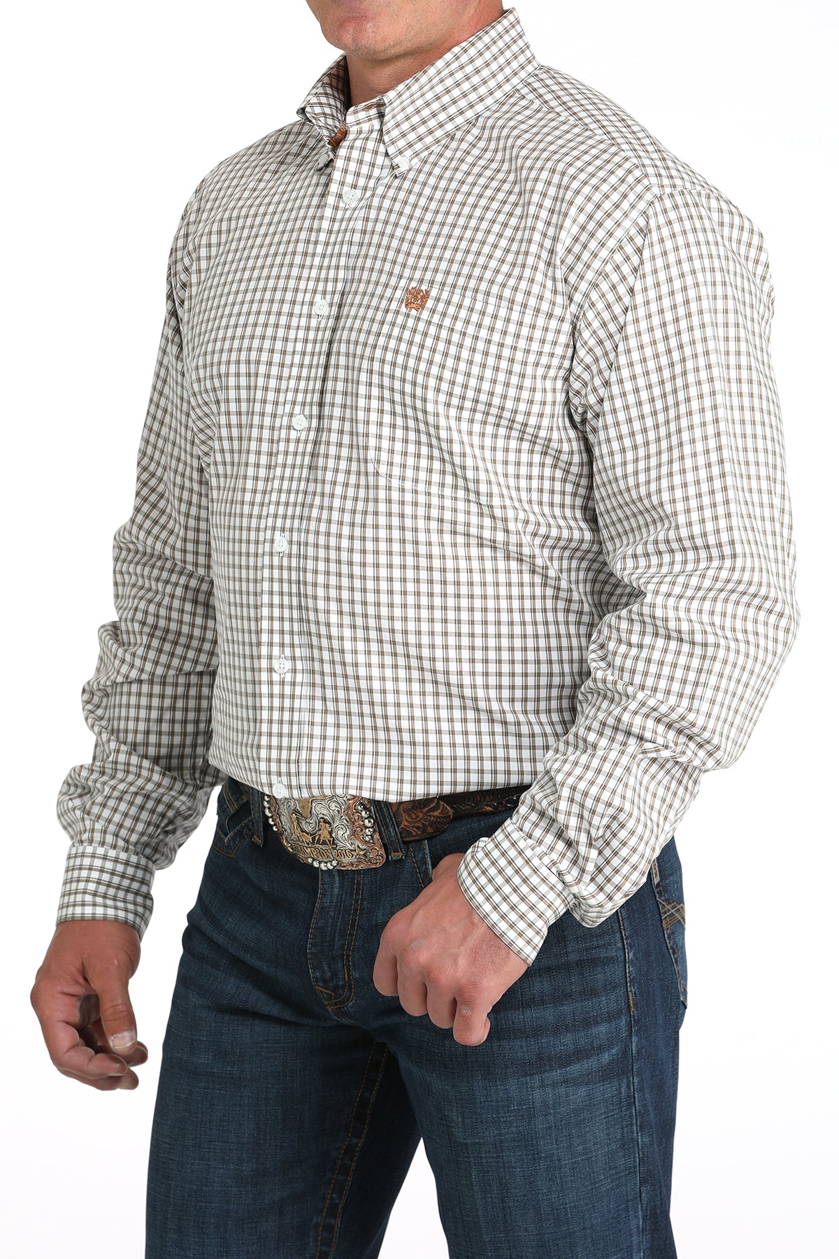 Man wearing a white plaid long sleeve button-down with jeans and a belt