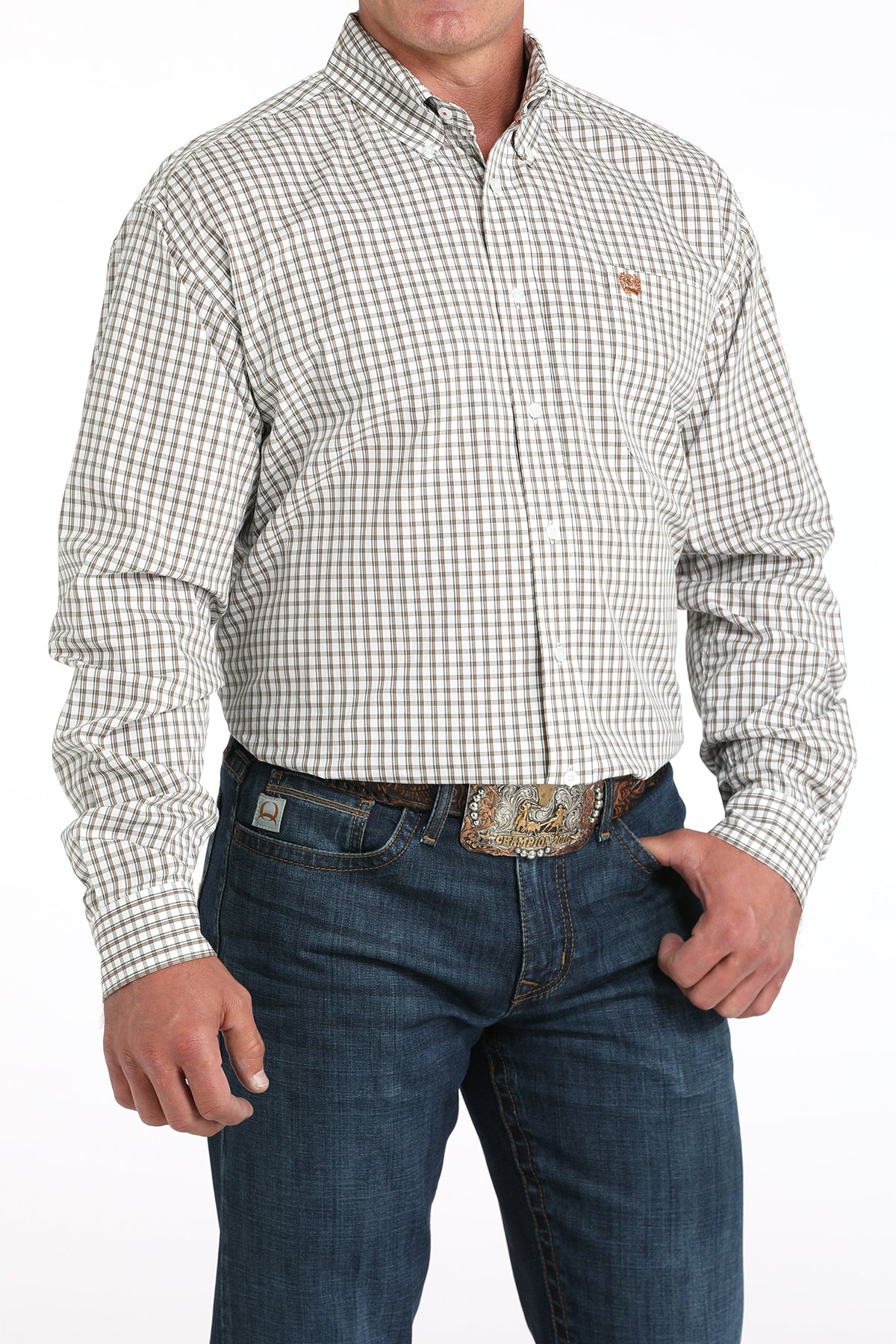 Man wearing a white plaid long sleeve button-down with jeans and a belt