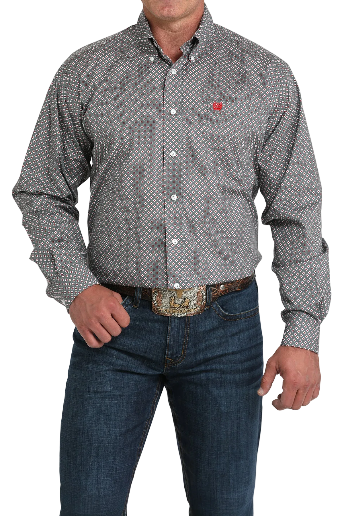 A man wearing a gray patterned button-up shirt, dark jeans, and a large belt buckle stands against a transparent background