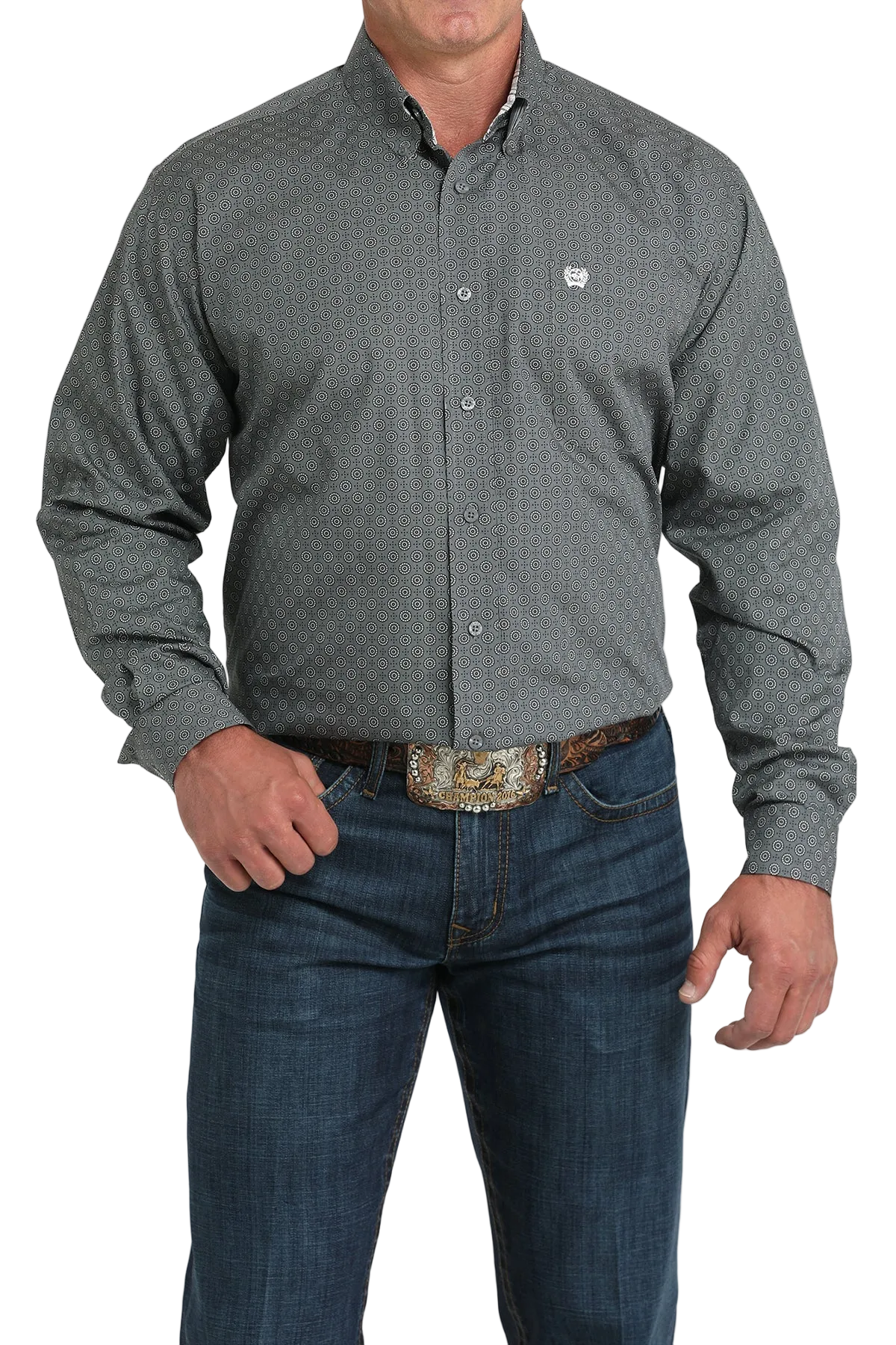 A man wearing a gray patterned button-up shirt, dark jeans, and a large belt buckle stands against a transparent background