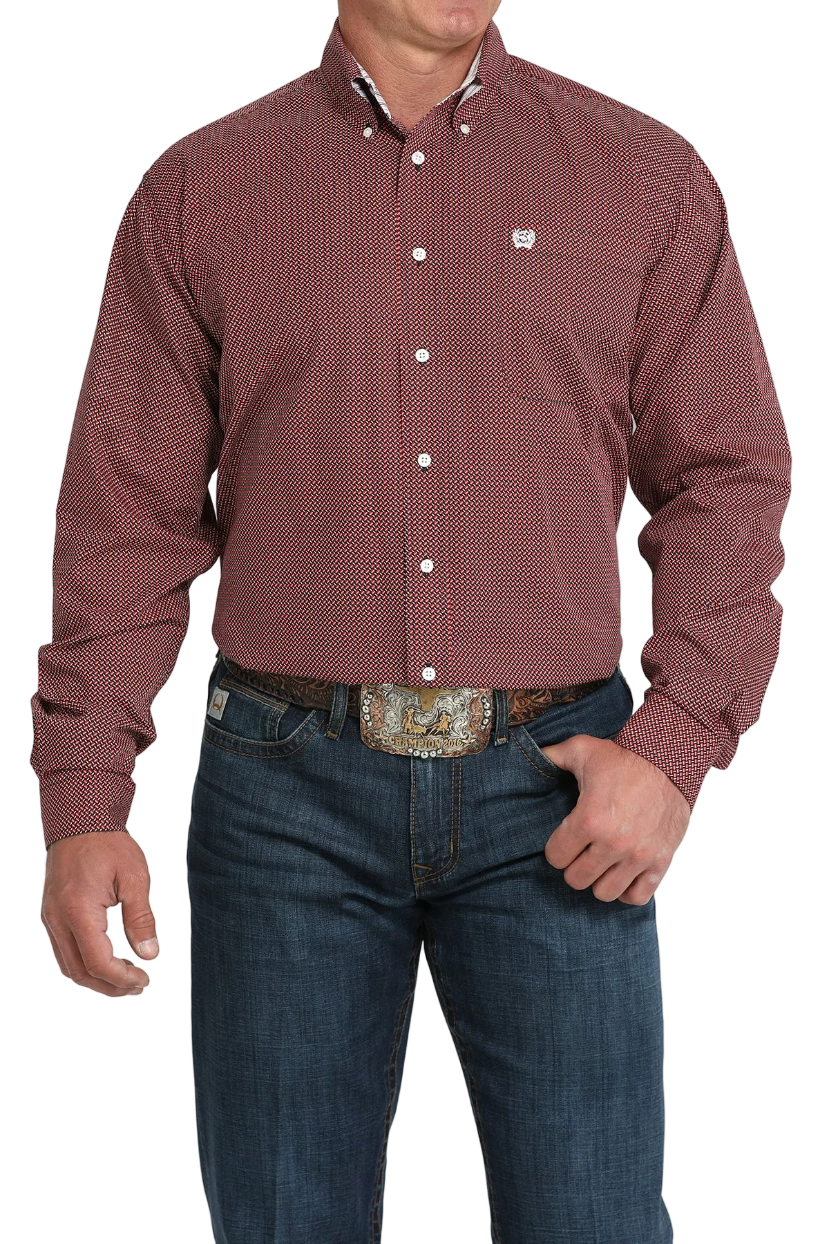 A man wearing a maroon patterned button-up shirt, dark jeans, and a large belt buckle, standing against a transparent background