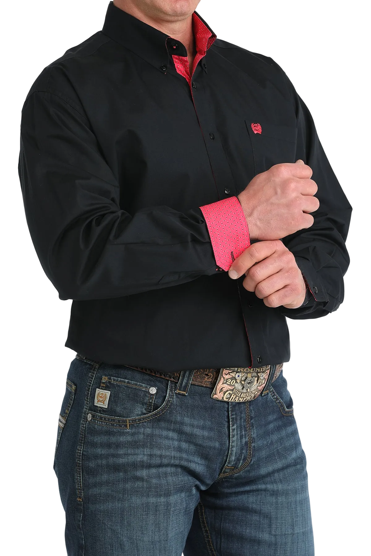 Person wearing a black shirt with red trim and blue jeans on a white background