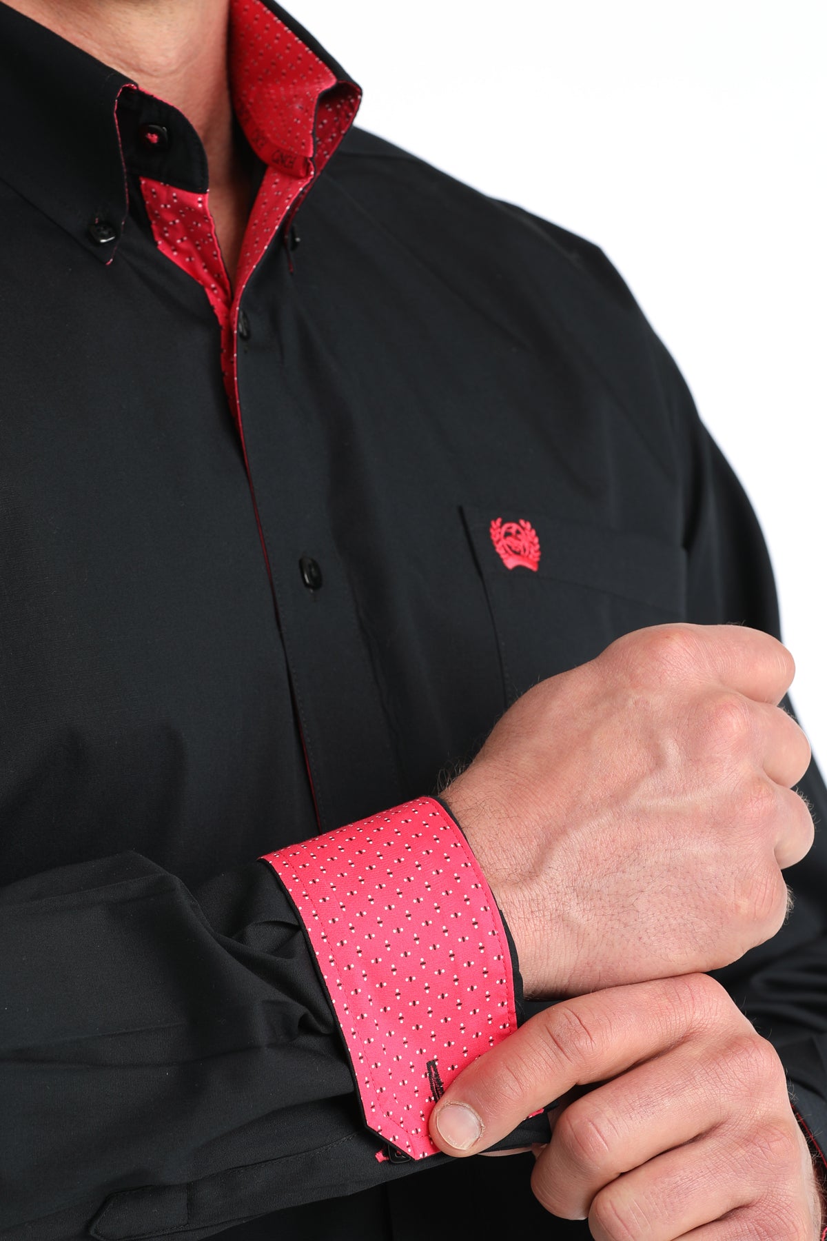 Black shirt with red interior and cuffs, featuring a small logo on the chest.