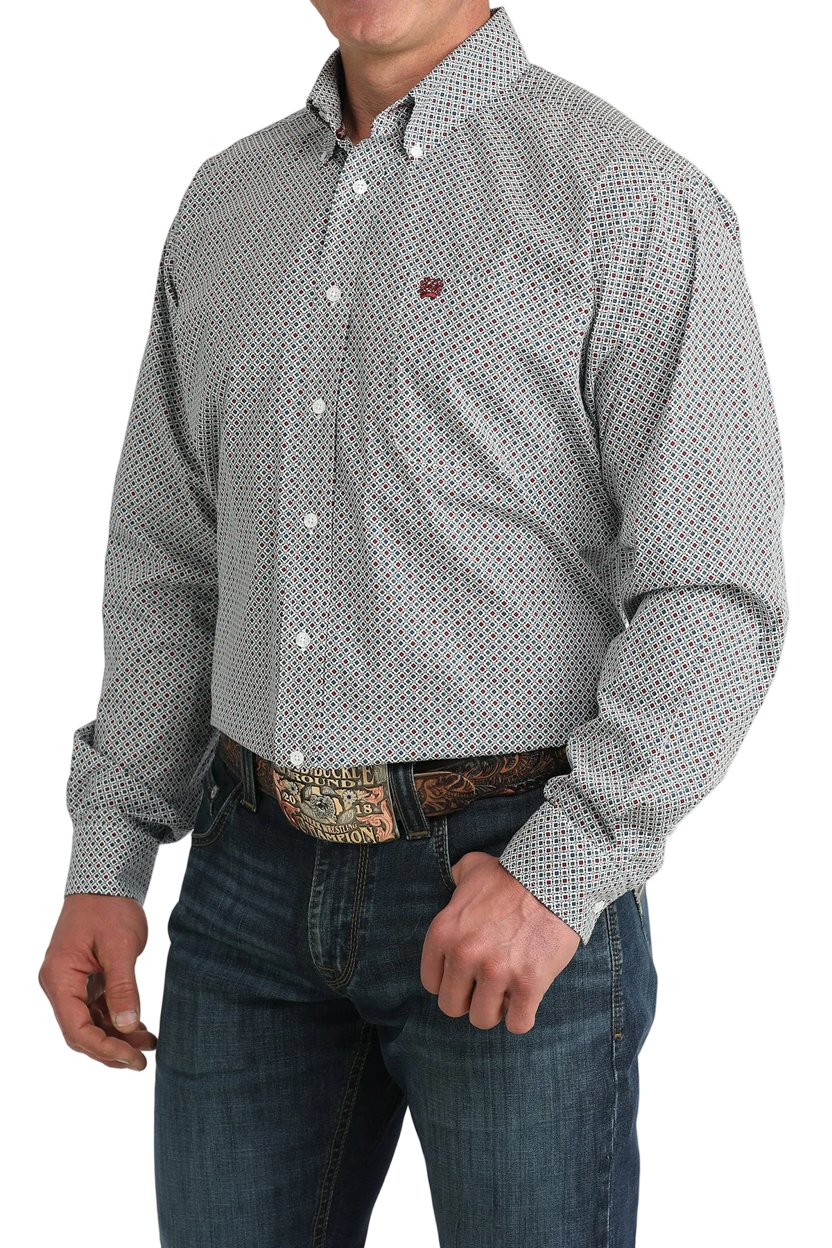 Man wearing a patterned gray shirt and jeans on a white background