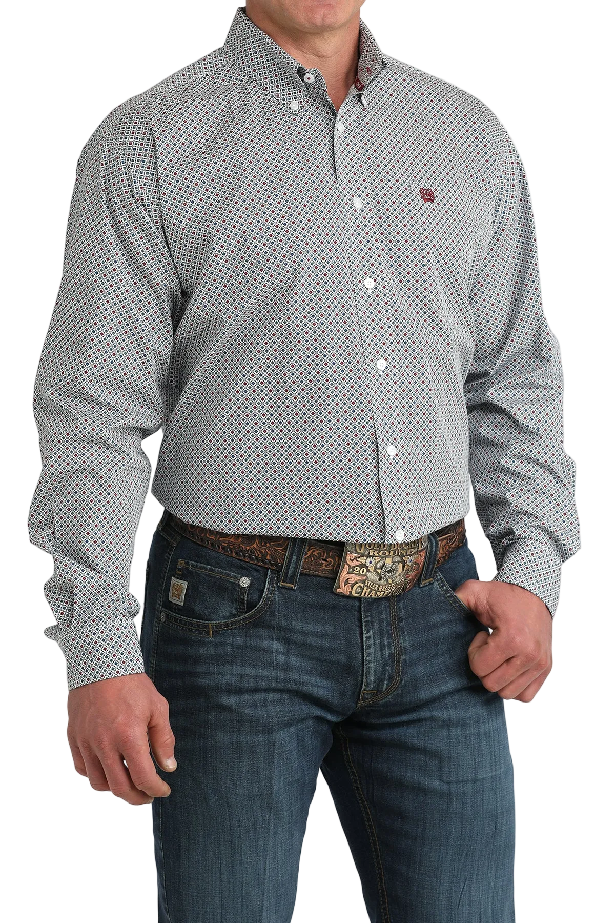 Man wearing a patterned shirt and jeans on a white background