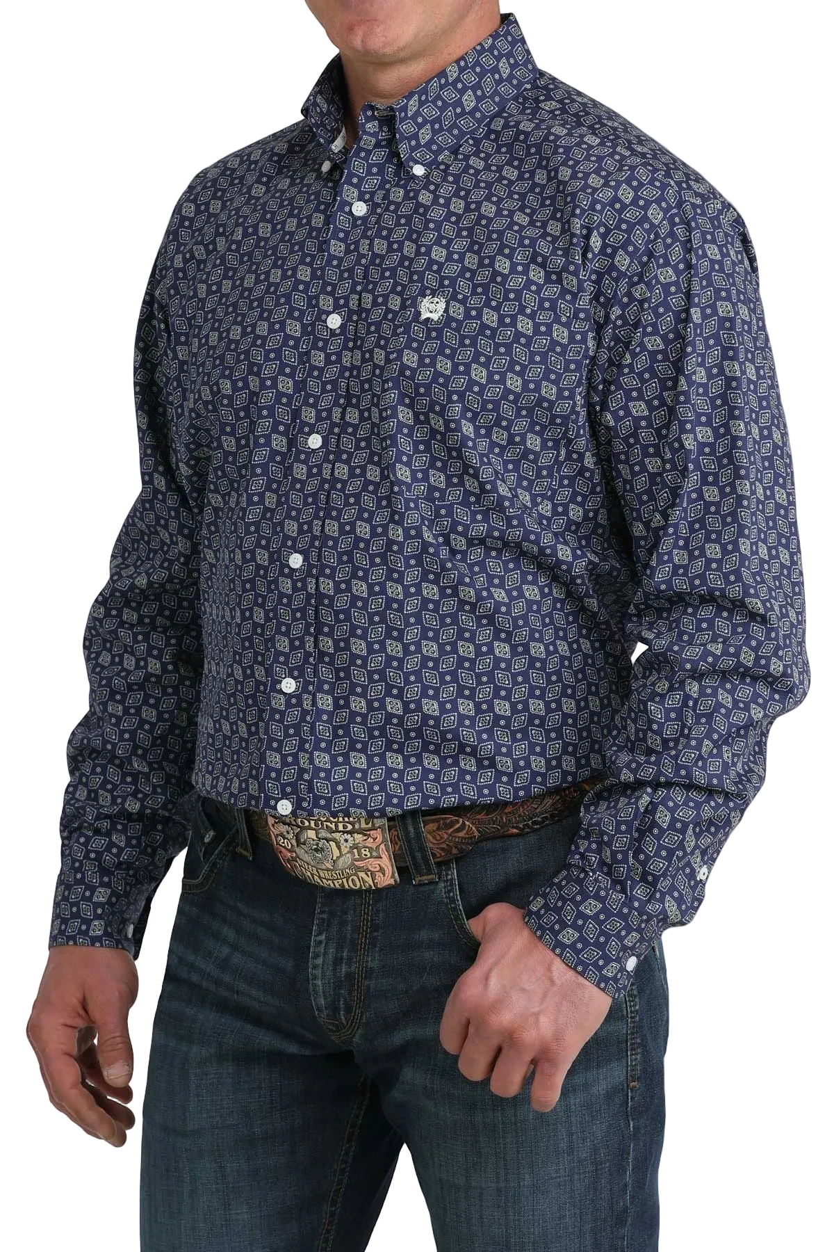 Man wearing a patterned blue shirt and jeans on a white background