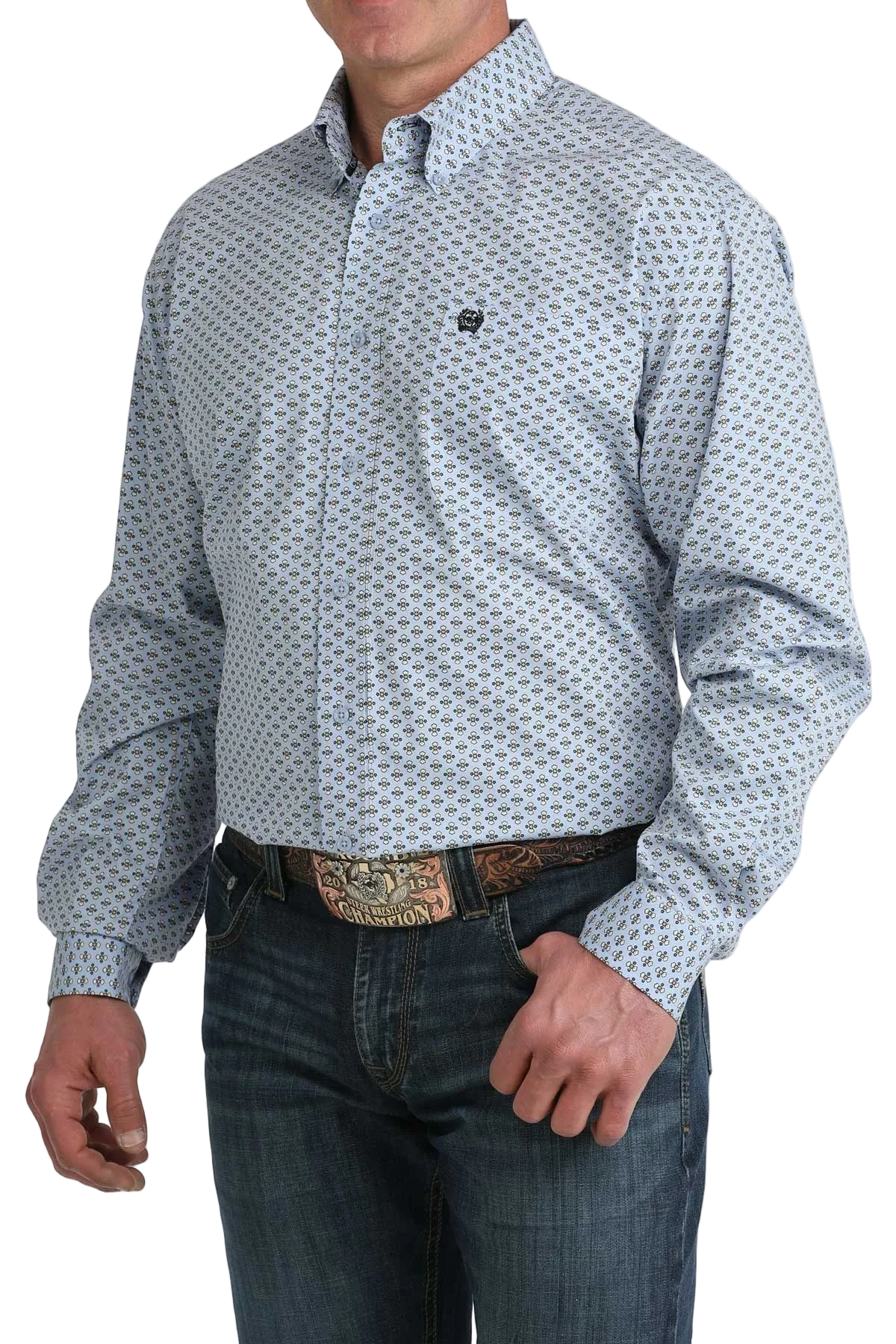 Man wearing a patterned shirt and jeans on a white background