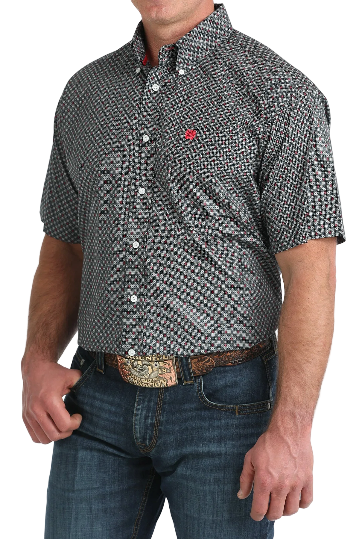 Man wearing a patterned short-sleeve shirt and jeans on a white background