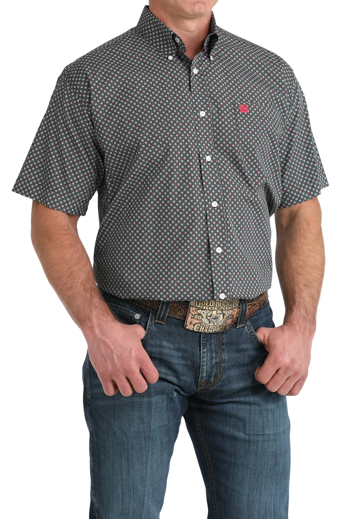 Man wearing a patterned short-sleeve shirt and jeans on a white background