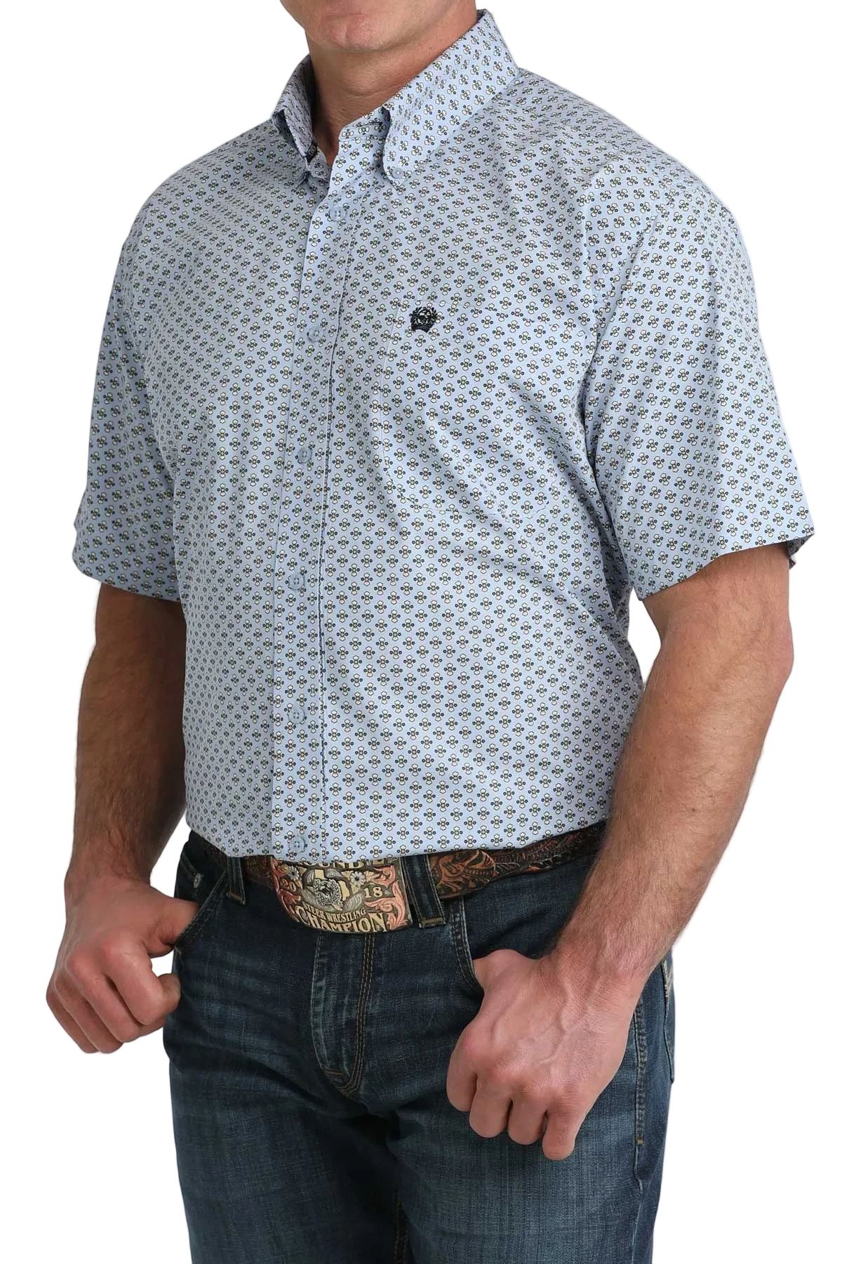Man wearing a patterned short-sleeve shirt and jeans on a white background