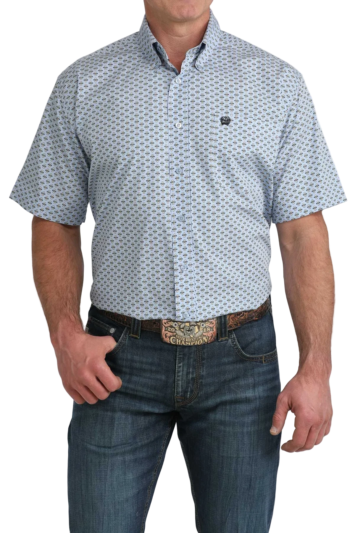 Man wearing a patterned short-sleeve shirt and jeans on a white background