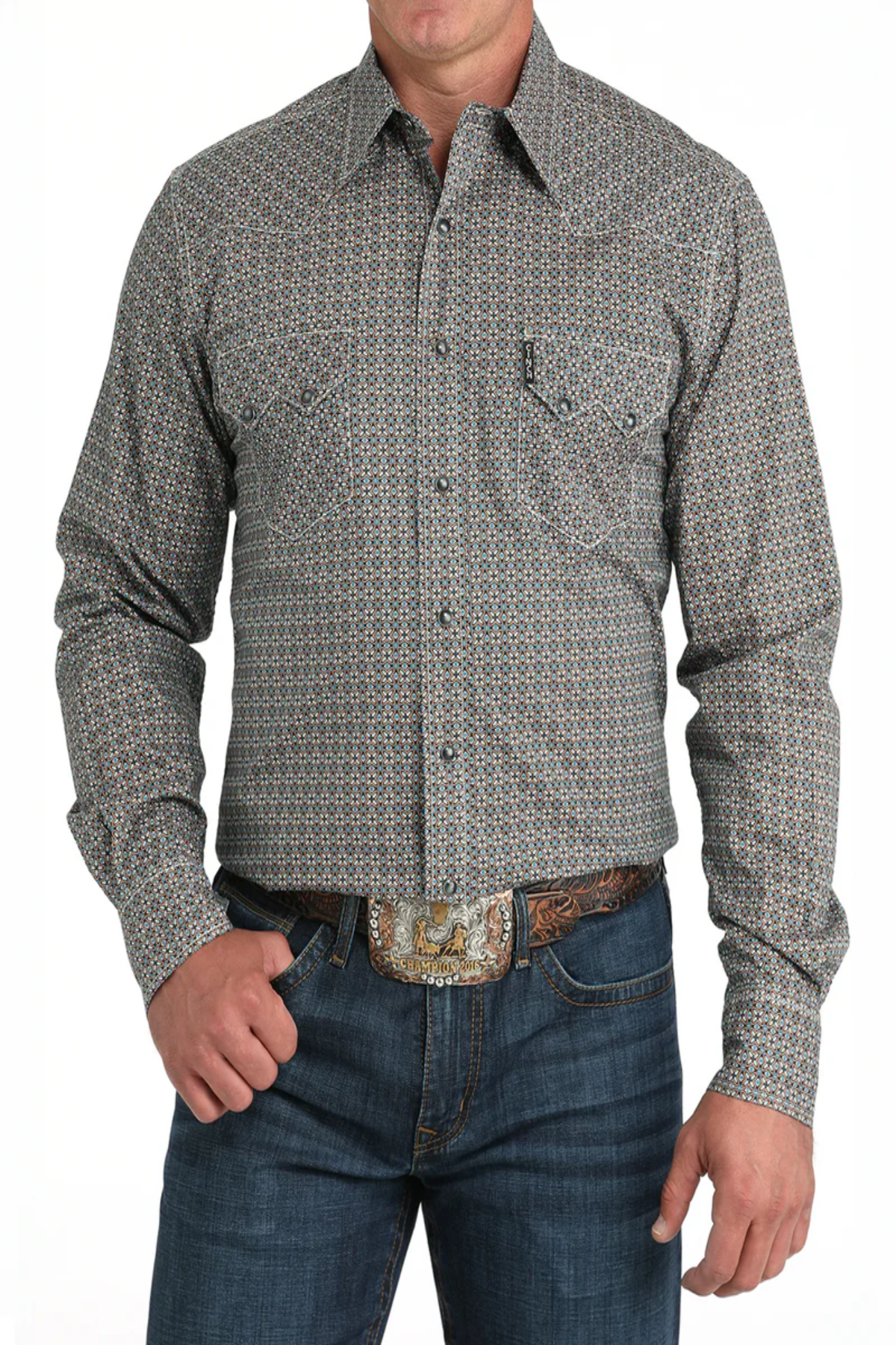Man wearing a patterned button-up shirt and jeans on a white background