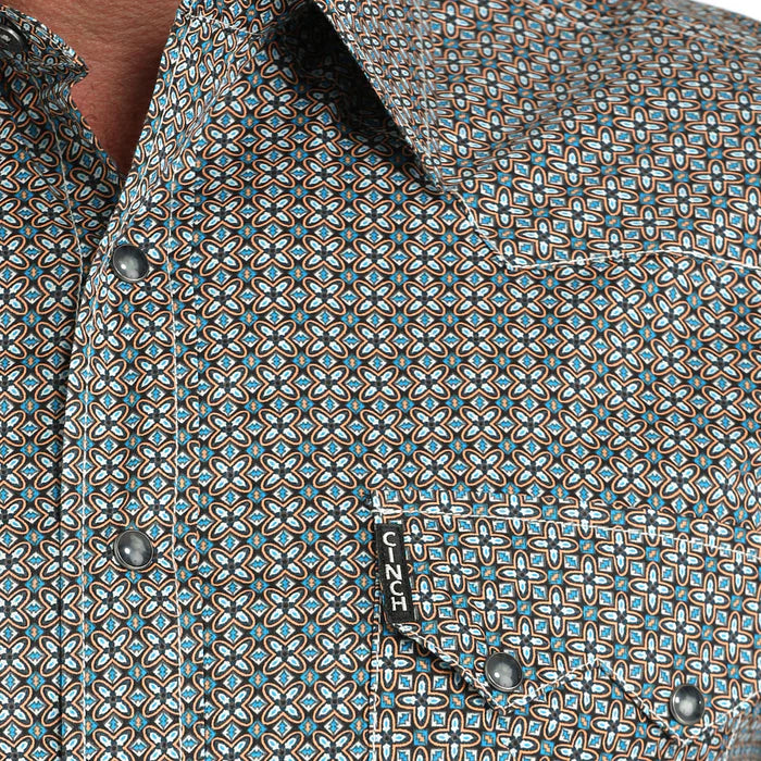 Close-up of a patterned shirt with a brand label visible.