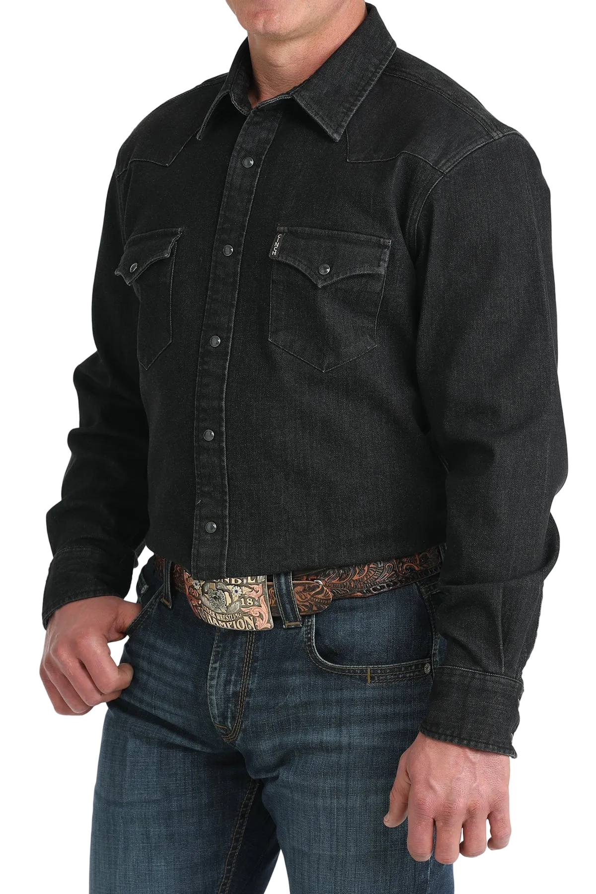 Black denim jacket worn by a person on a white background