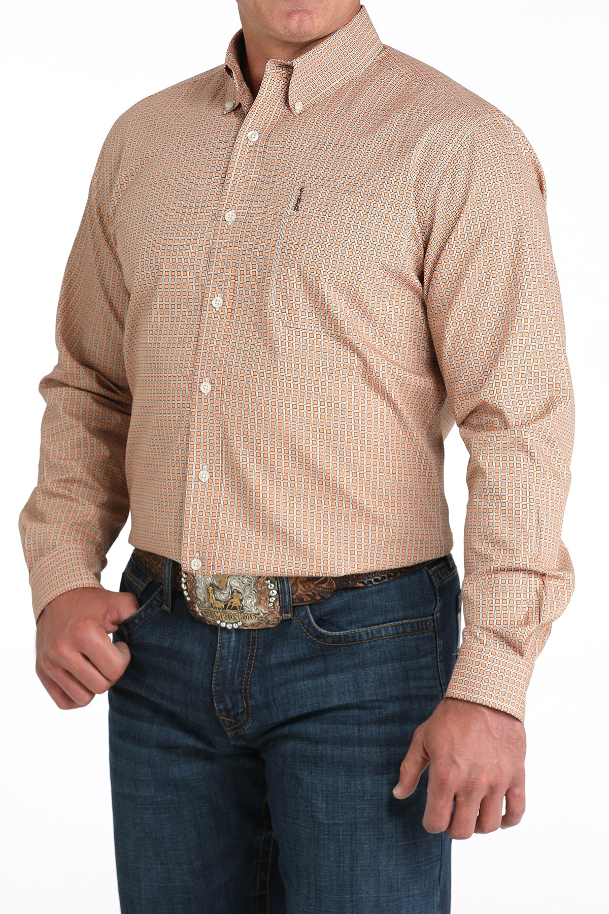 Man wearing a beige checkered shirt and blue jeans with a belt buckle on a white background