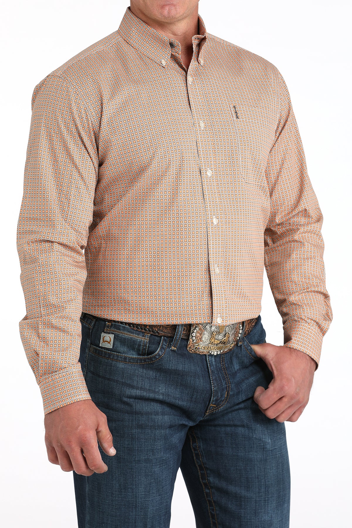 Man wearing a beige checkered shirt and blue jeans on a white background