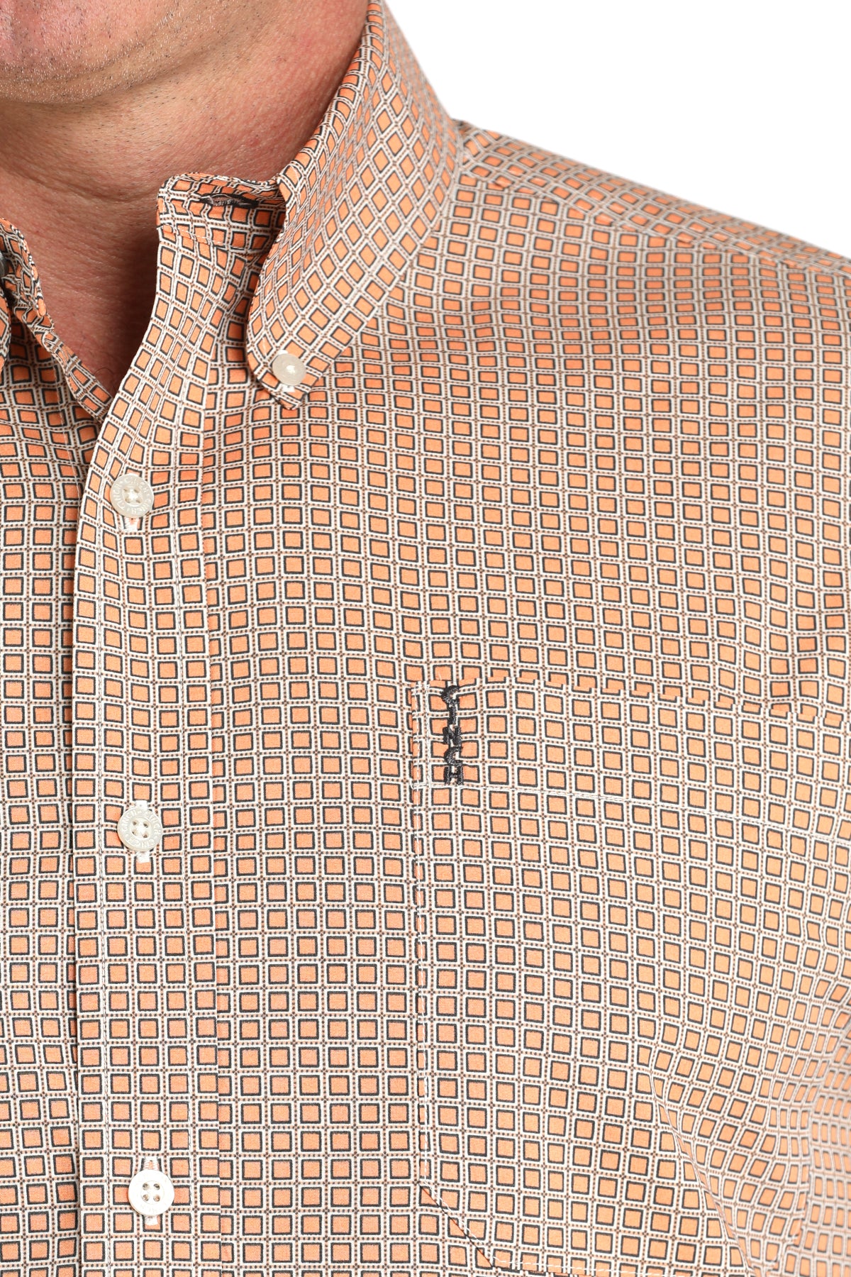 Close-up of a patterned shirt with a collar and buttons.