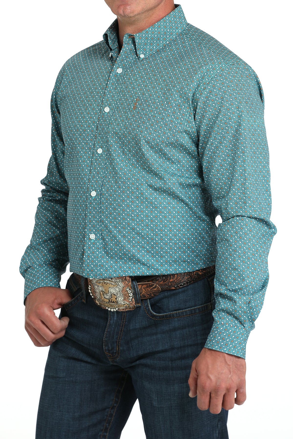 Man wearing a teal long sleeve button-down with jeans and a belt