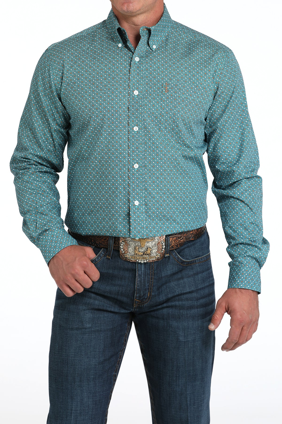 Man wearing a teal long sleeve button-down with jeans and a belt