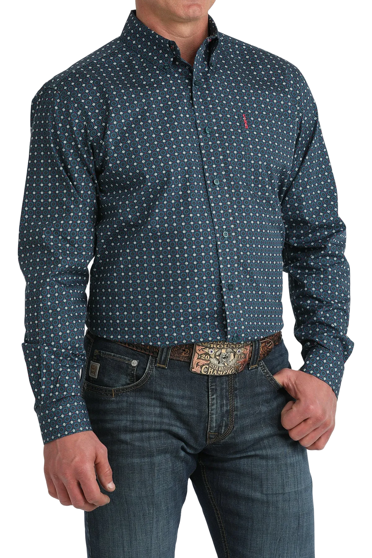 Man wearing a blue patterned shirt and jeans with a belt buckle.