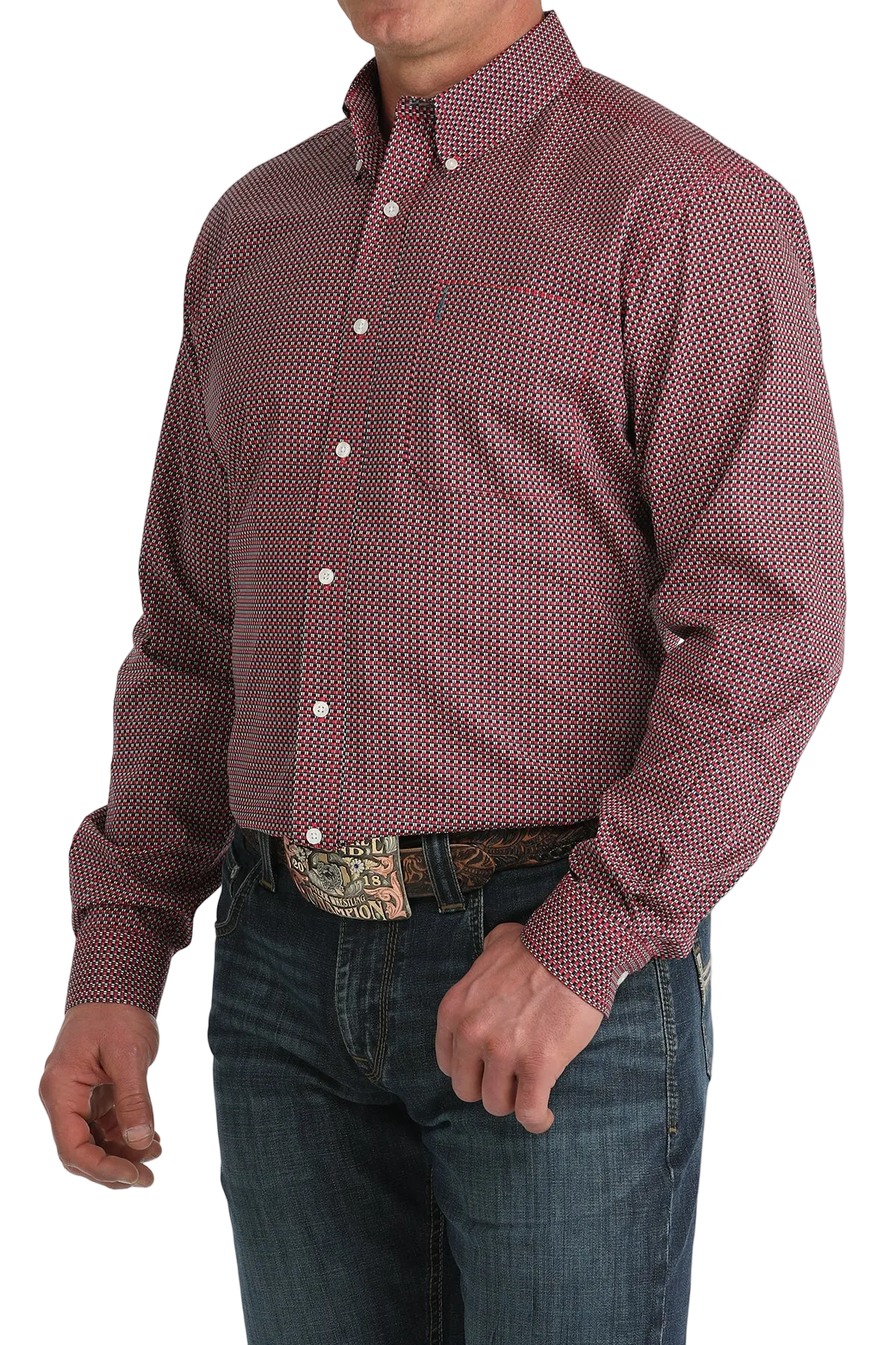 Man wearing a patterned red and white shirt with jeans on a white background