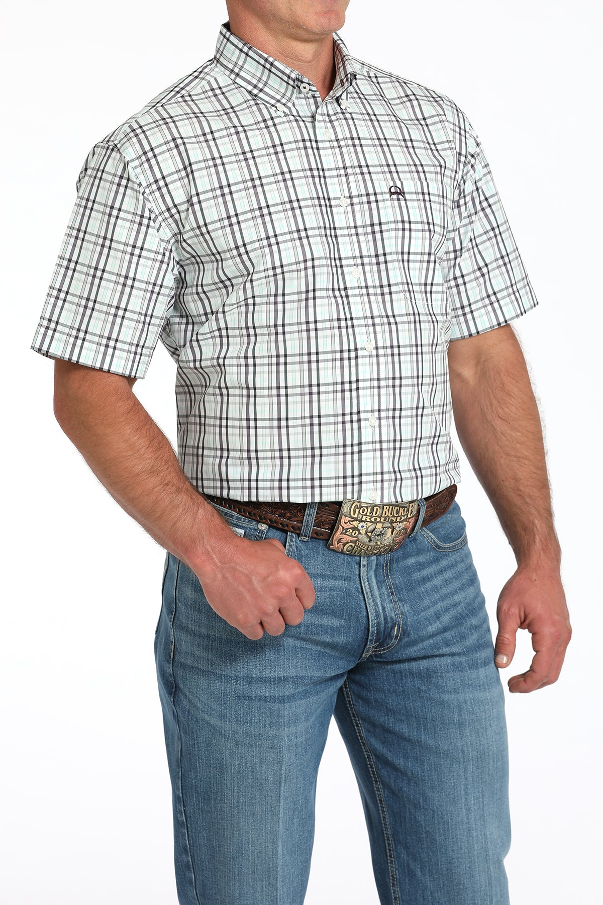 Man wearing a plaid short-sleeve shirt and jeans on a white background
