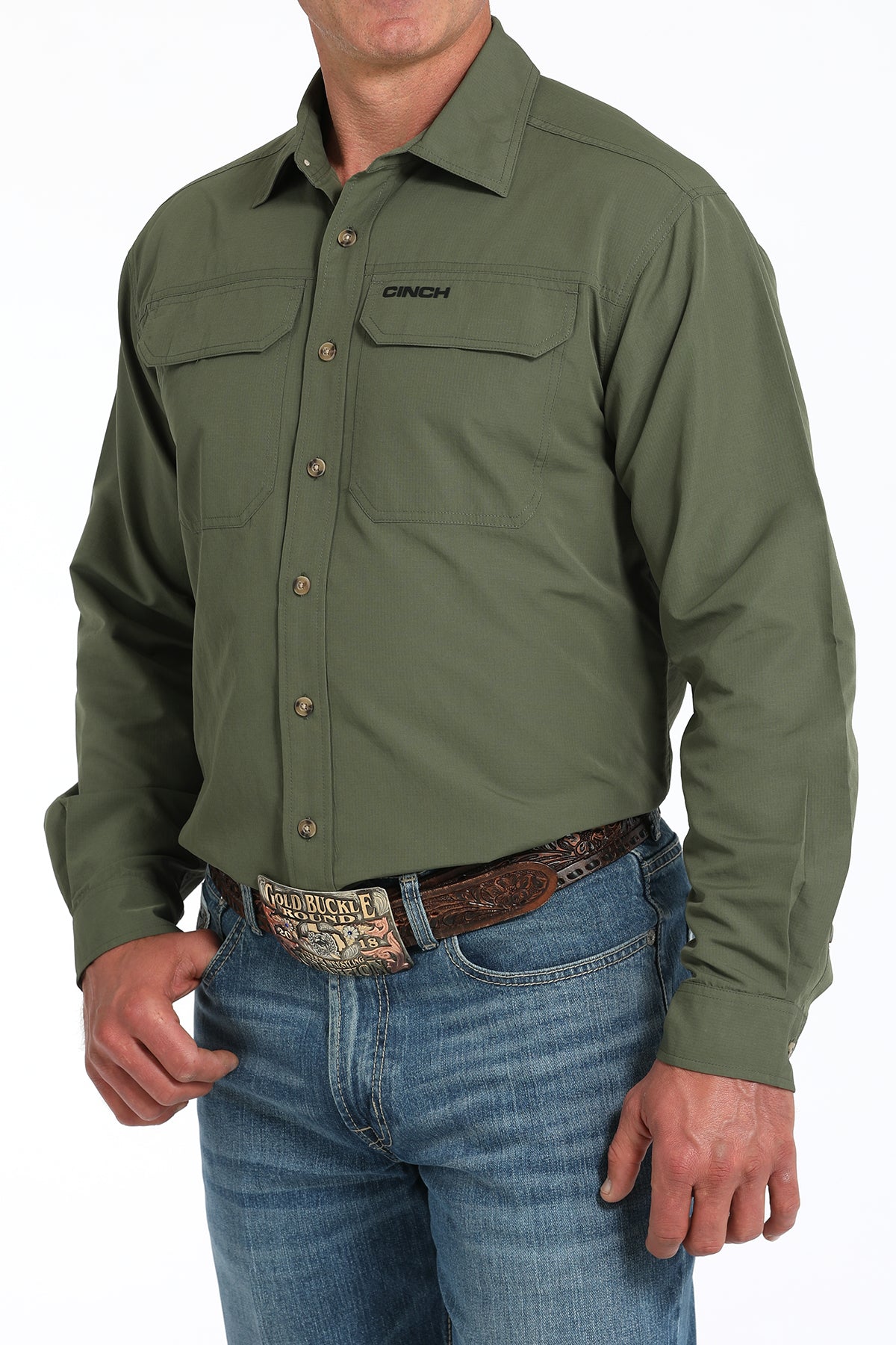 Green shirt worn by a person on a white background