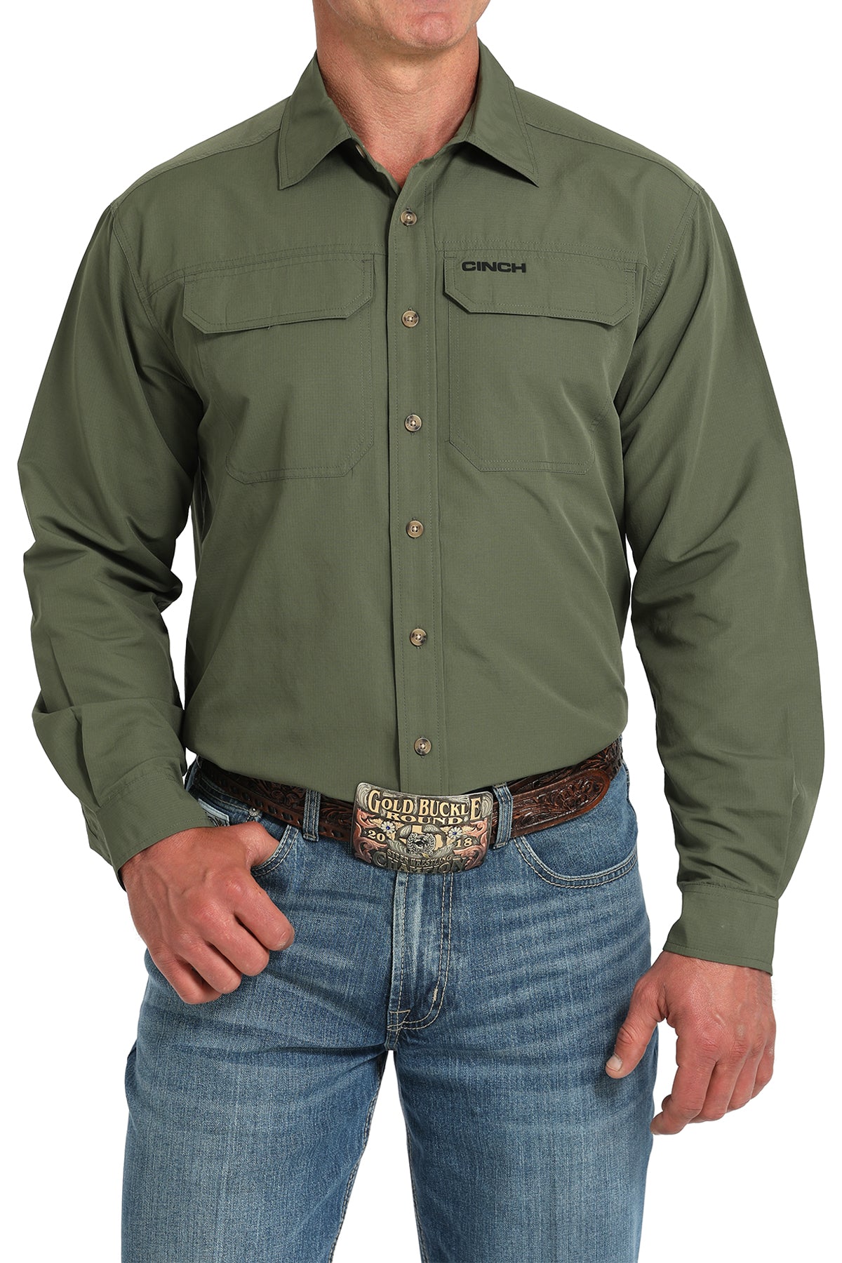 Green work shirt with 'Cinch' branding worn by a person on a white background