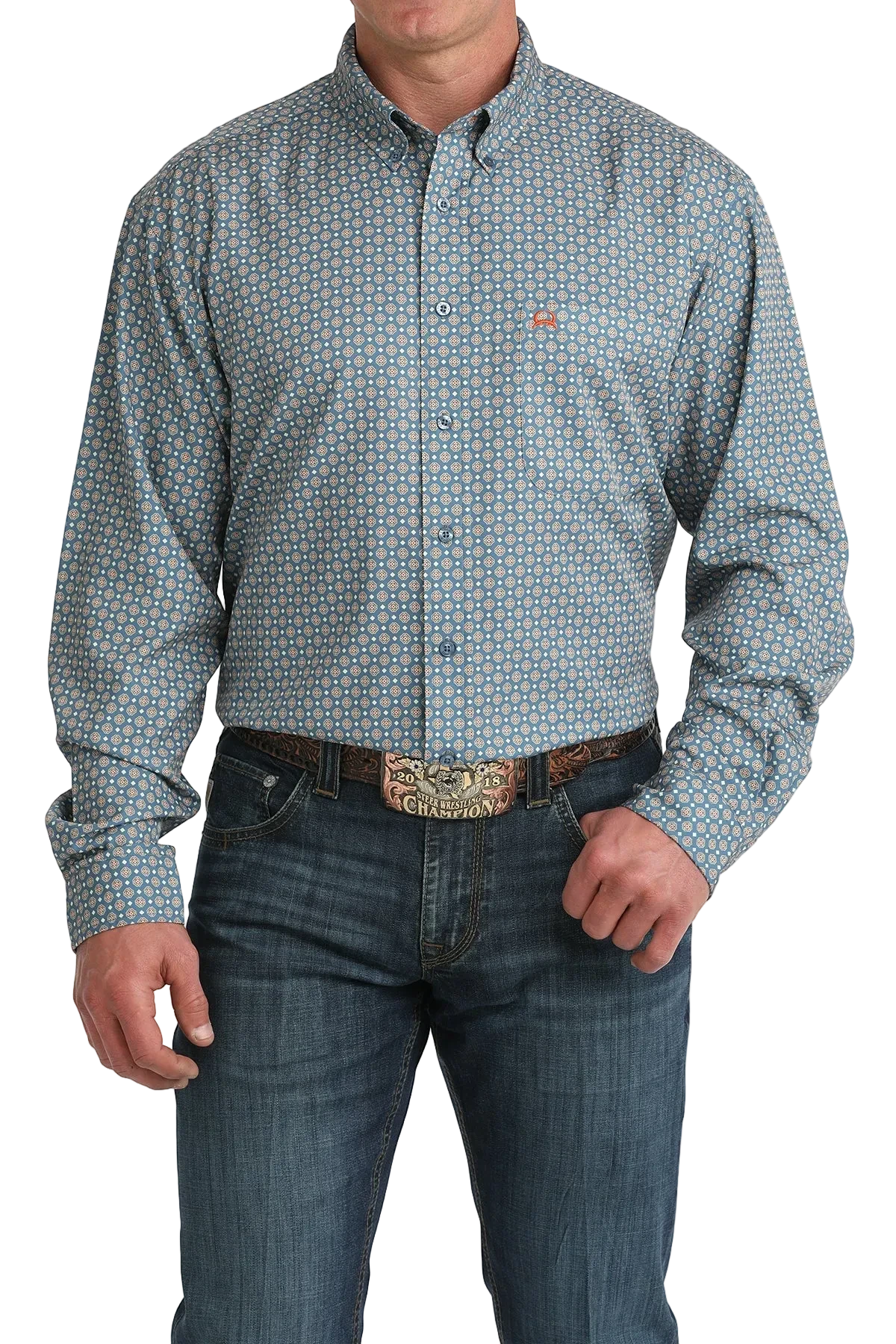 Man wearing a patterned shirt and jeans with a belt buckle on a white background