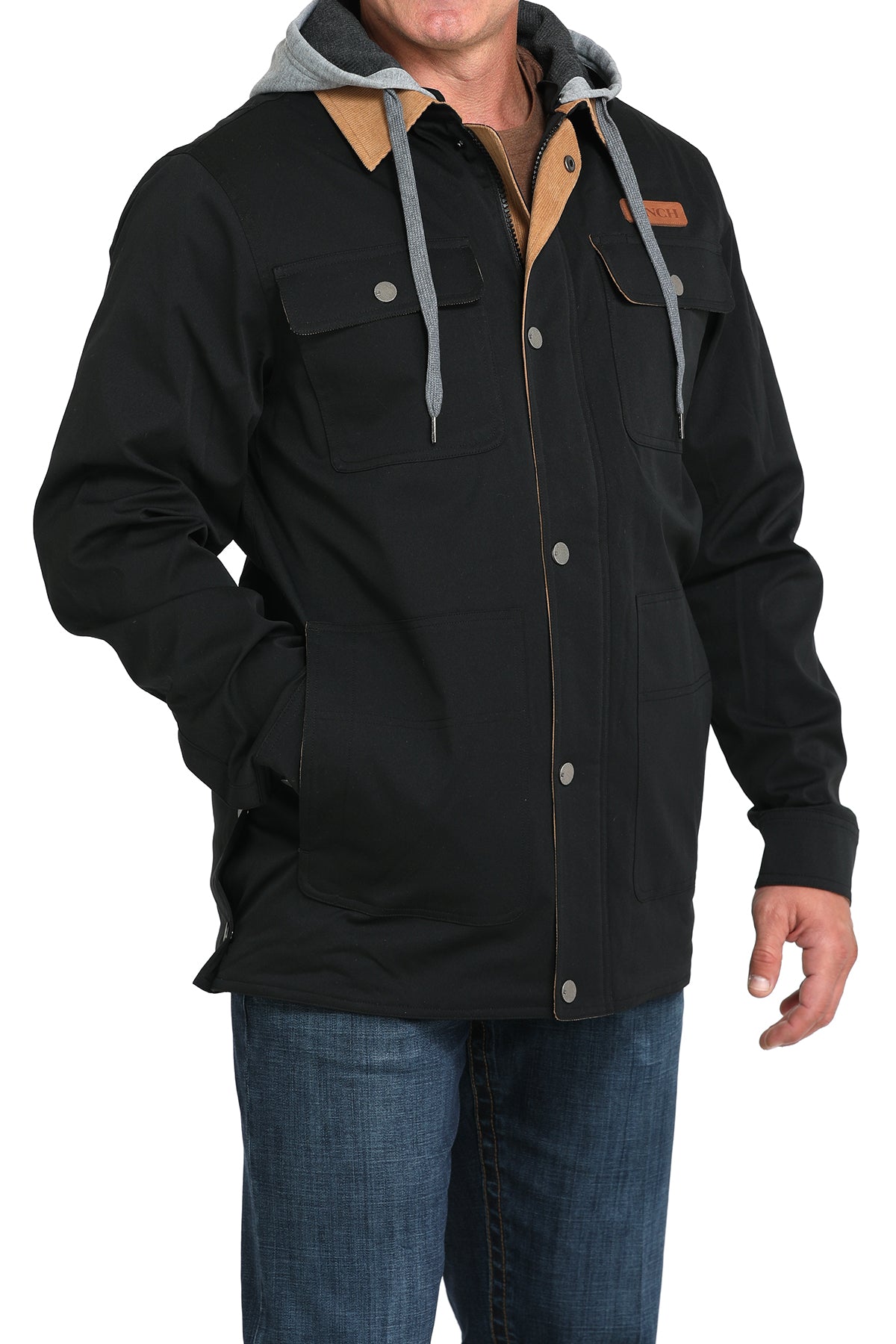 Man wearing a black jacket and jeans on a white background