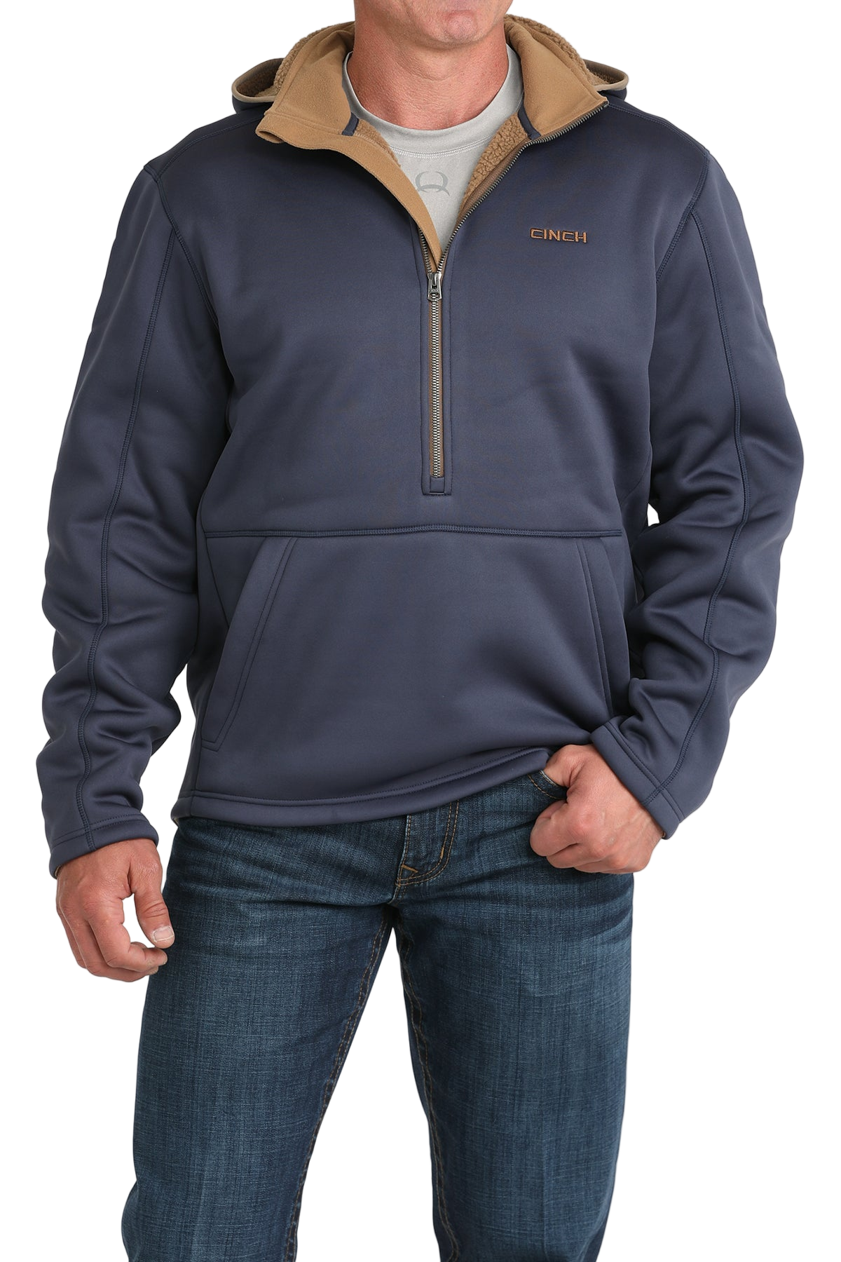 Man wearing a blue quarter-zip pullover with a tan inner collar and a front kangaroo pocket, paired with blue jeans