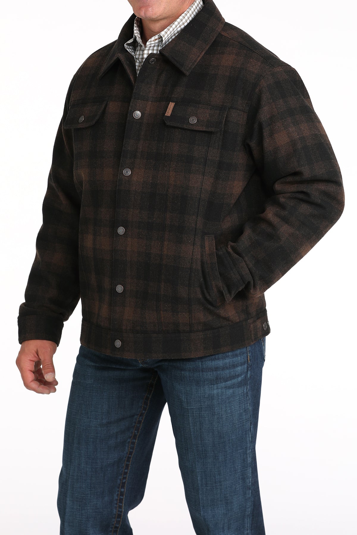 Man wearing a brown patterned jacket with jeans