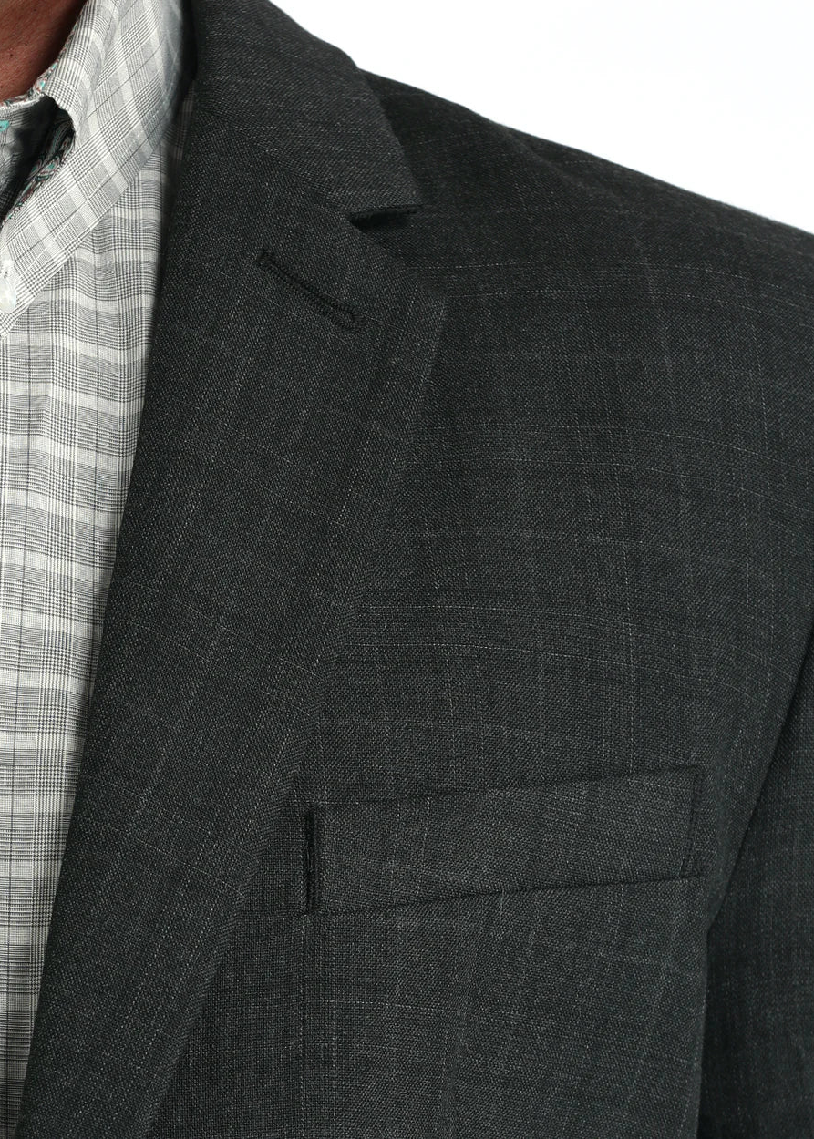 Gray suit jacket with a plaid shirt underneath on a white background