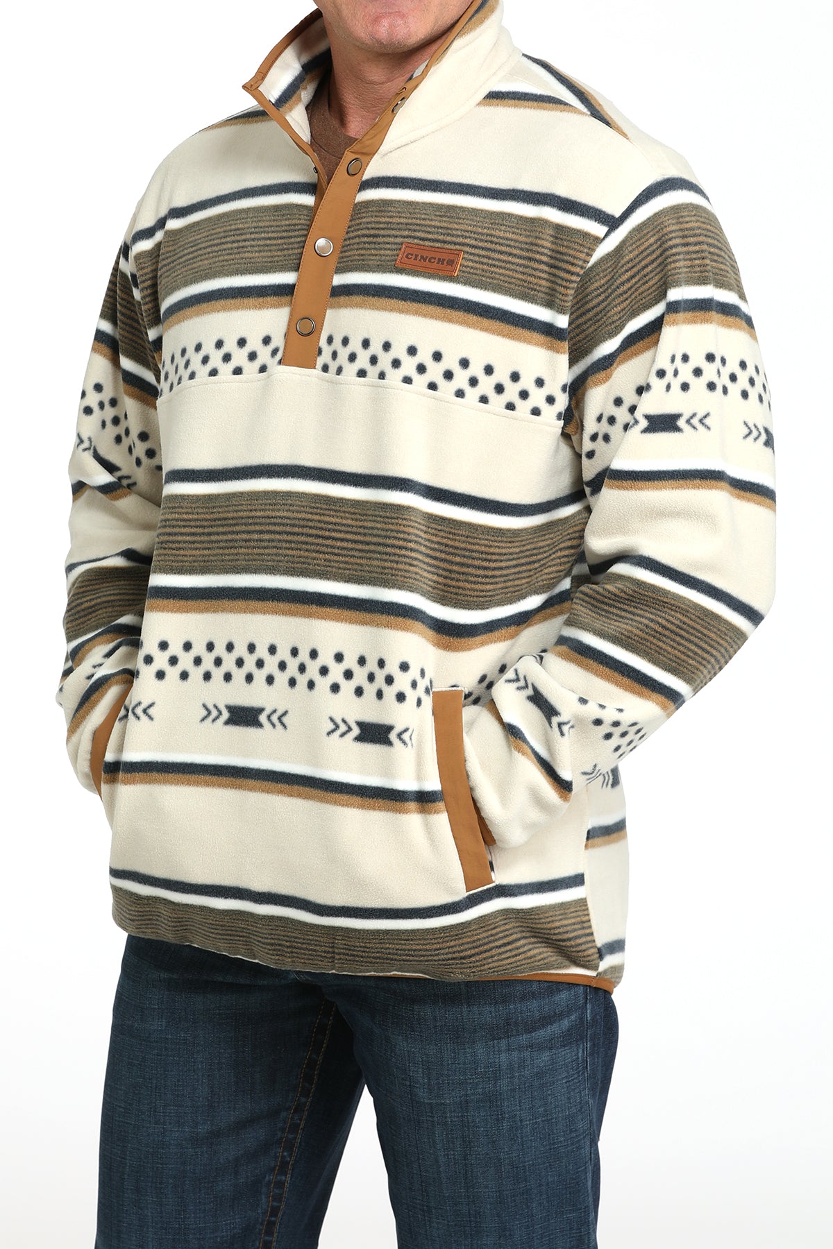 Man wearing a white striped fleece pullover with jeans