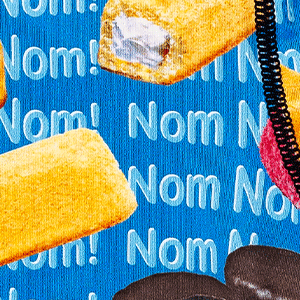 Close-up of men's Cinch underwear featuring an all-over 'sweet treat' pattern with the words "Nom Nom!" repeated in the background