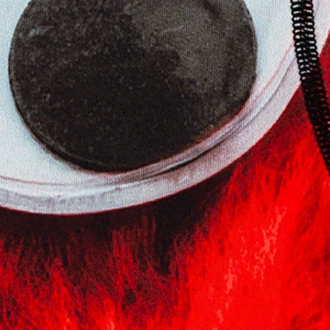 Close-up view of men's Cinch underwear featuring a picture of a red monster with large googly eyes