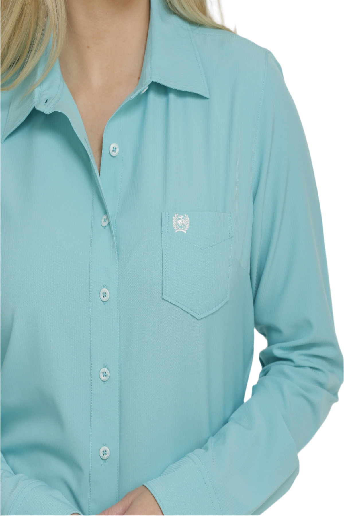 Close-up of a woman wearing a light blue button down shirt