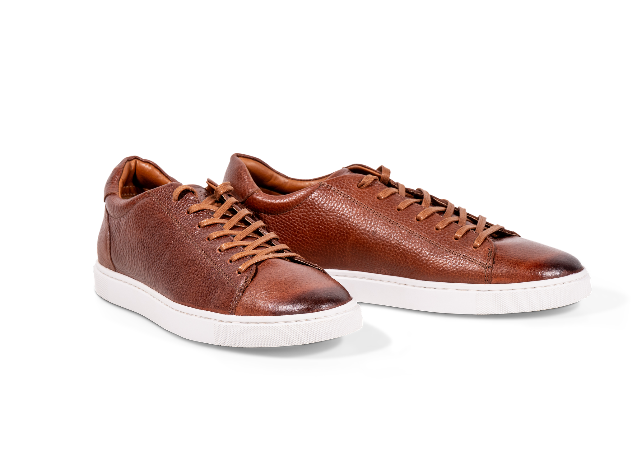Pair of Go West Supply brown leather sneakers on a white background