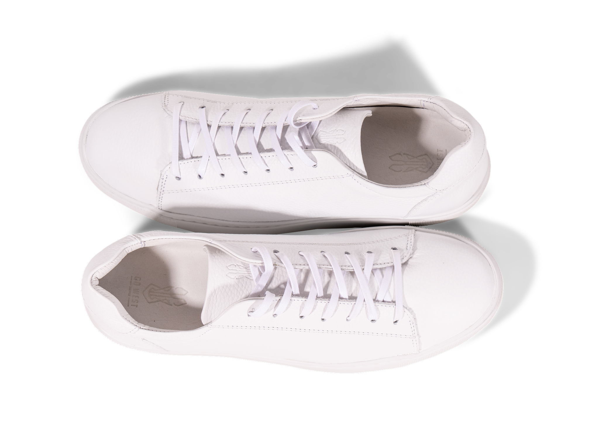 Pair of white Go West Supply Leather sneakers on a white background