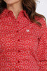 Close-up view of a red printed long sleeve shirt with button-down collar and Cinch logo on chest pocket