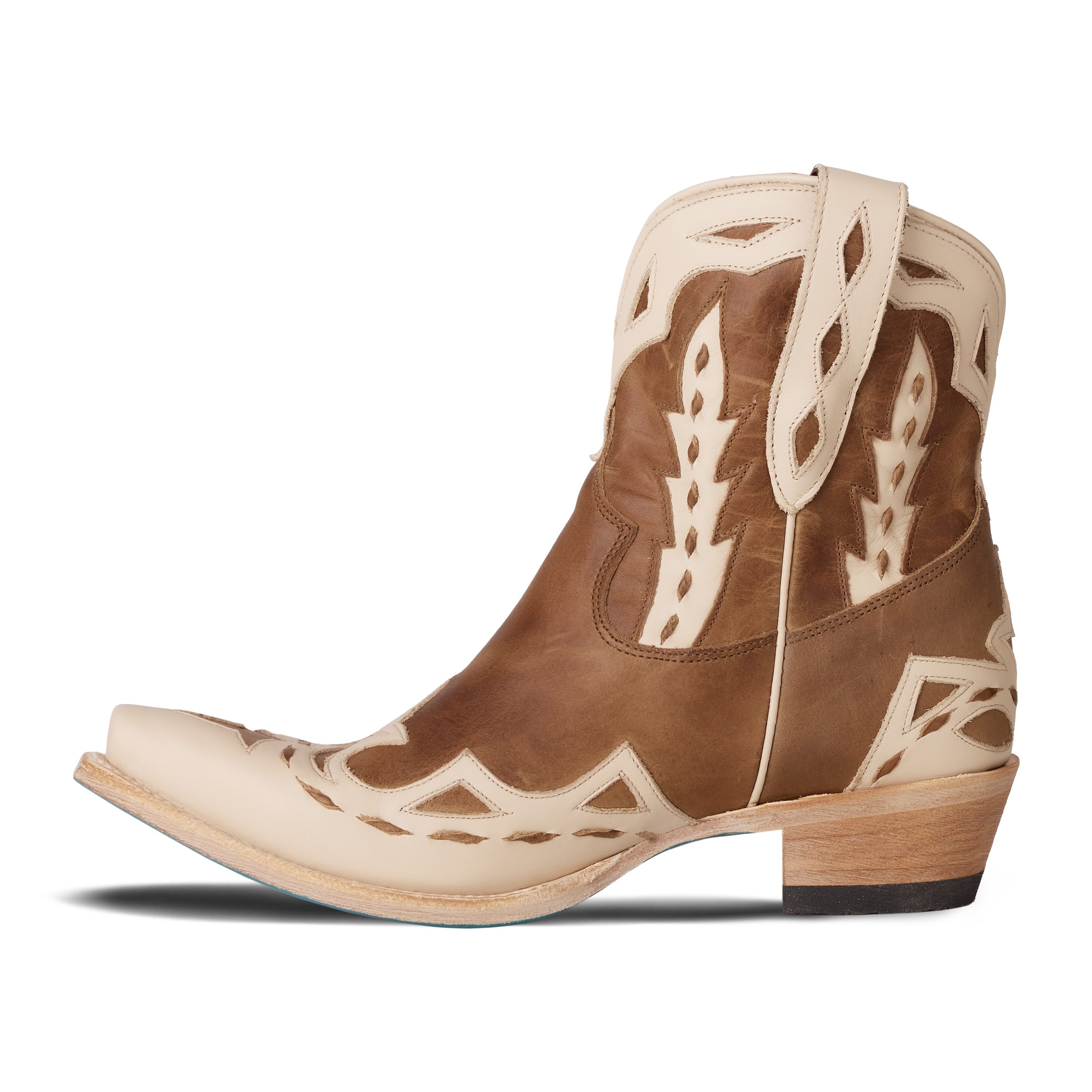 A brown and cream western ankle boot featuring detailed stitching, a short shaft with pull tabs, and contrasting cream overlays