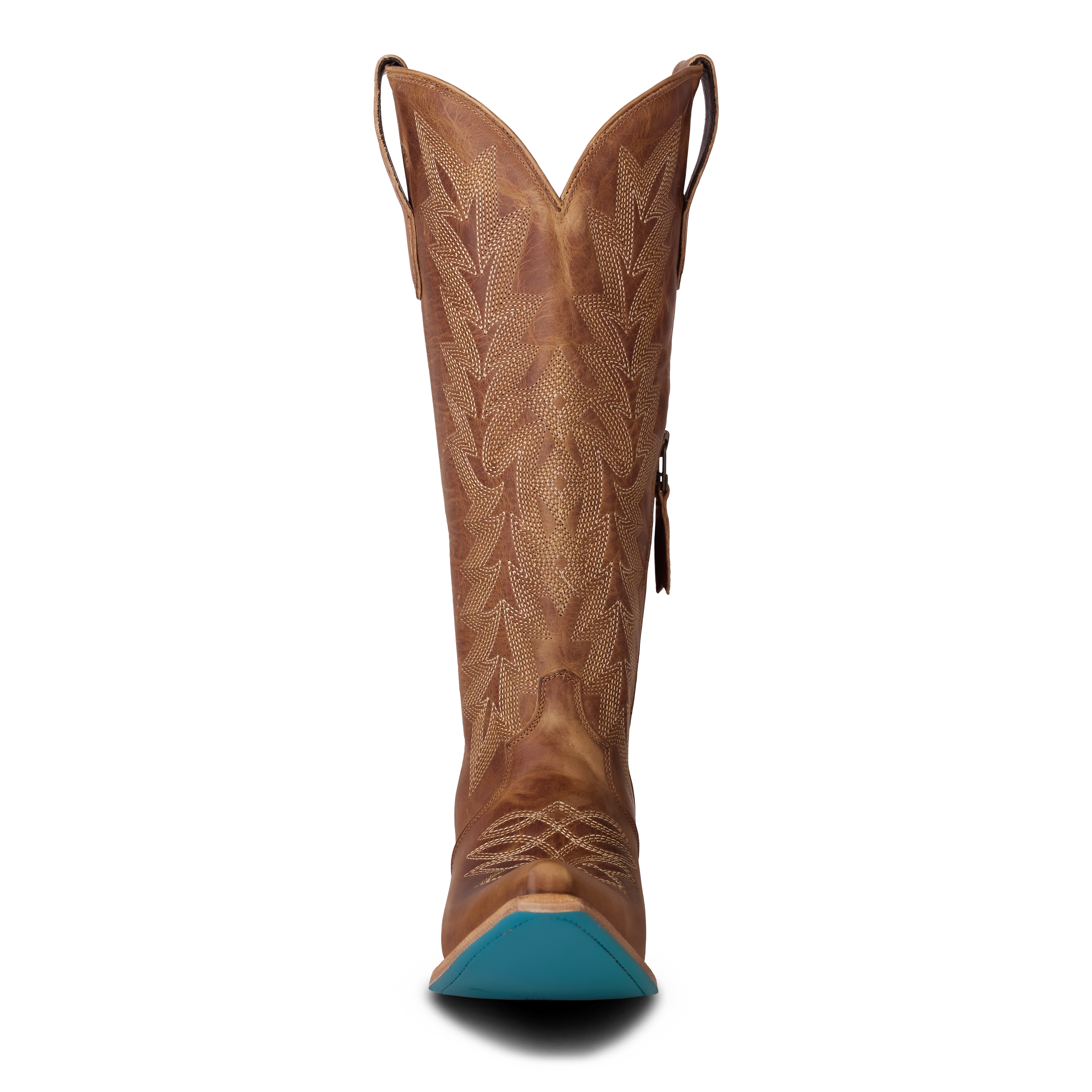 Front view of a tall tan leather cowboy boot with detailed stitched patterns running up the shaft, curved pull loops on each side, and a signature bright turquoise sole visible at the heel